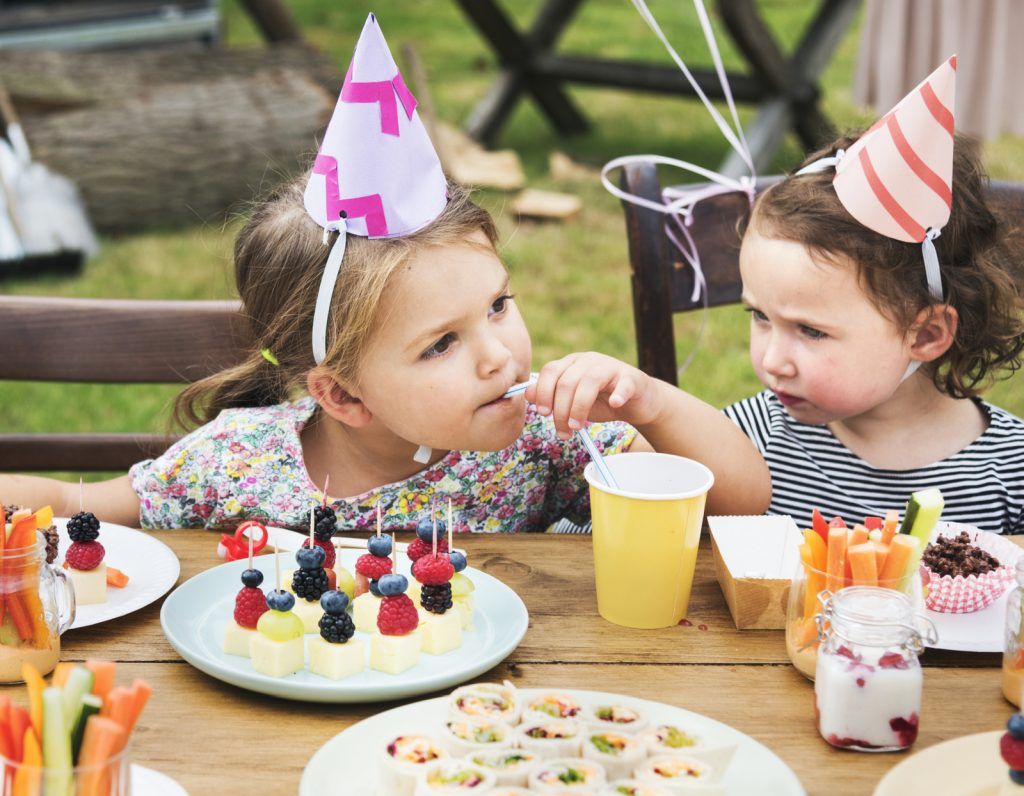 kids enjoying party food